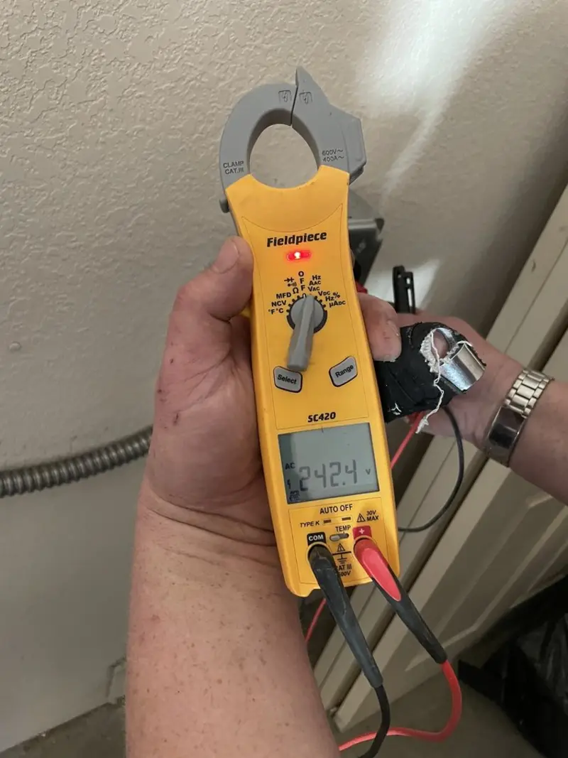 Voltage testing with clamp meter during Electrical Installation Services in Chatham